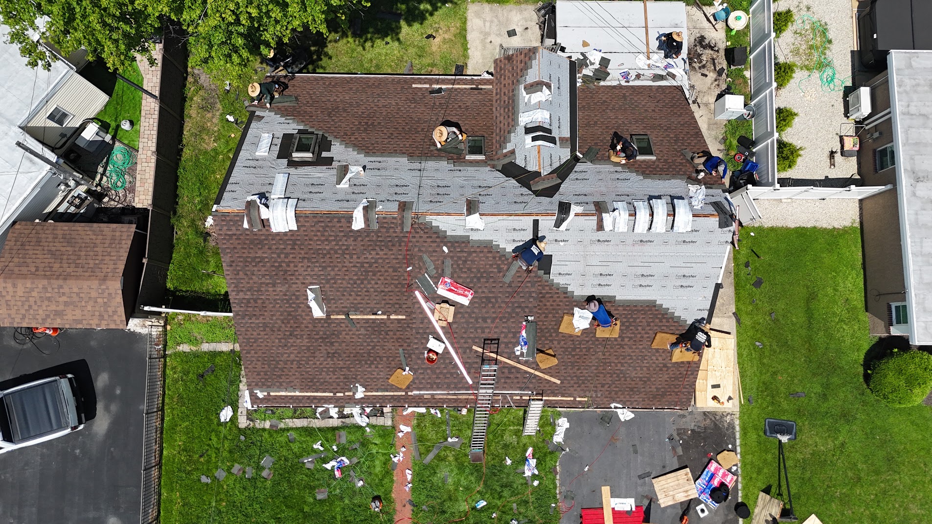 Full roof replacement in progress with crew
