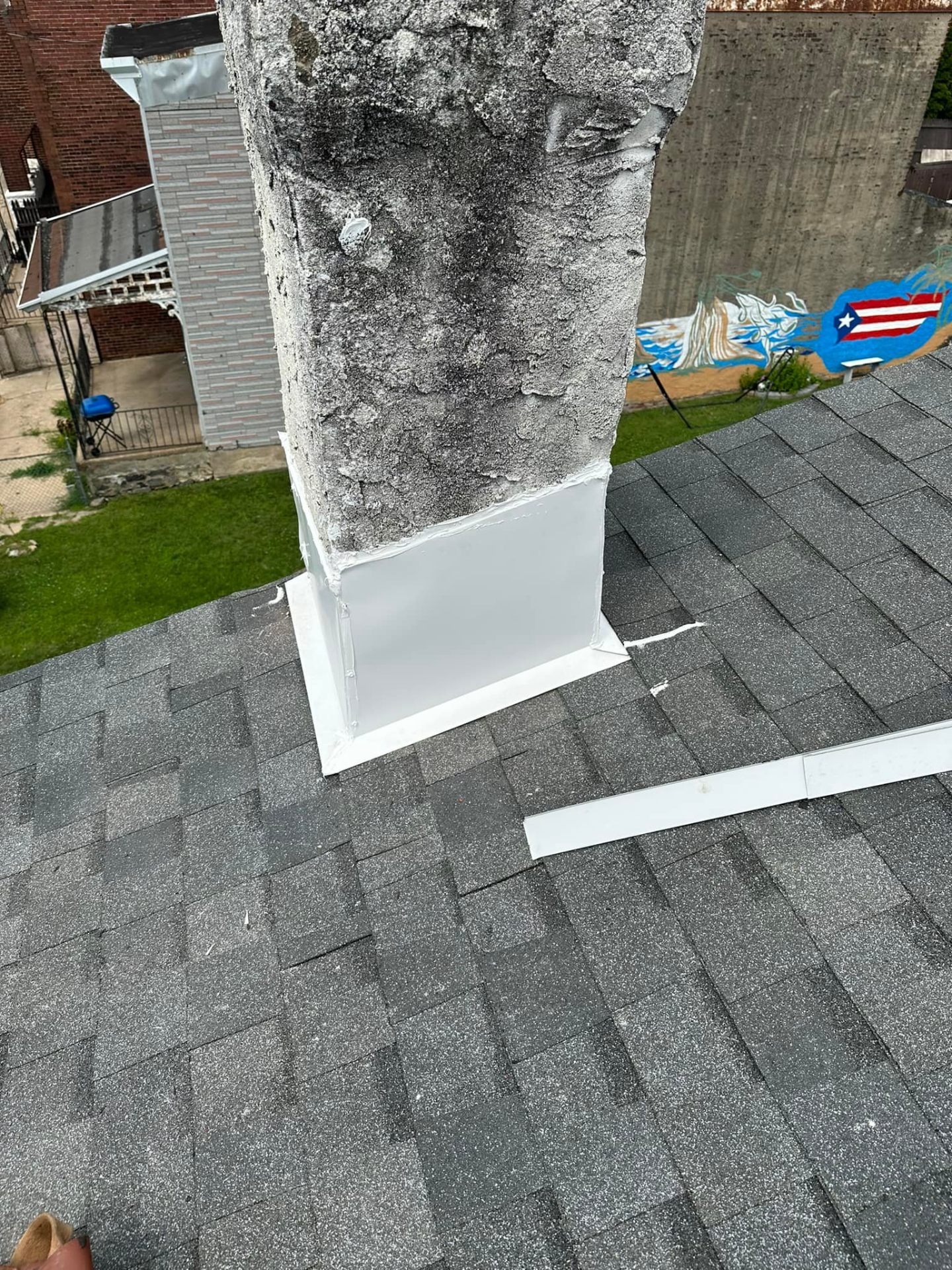 Chimney flashing repair on shingle roof