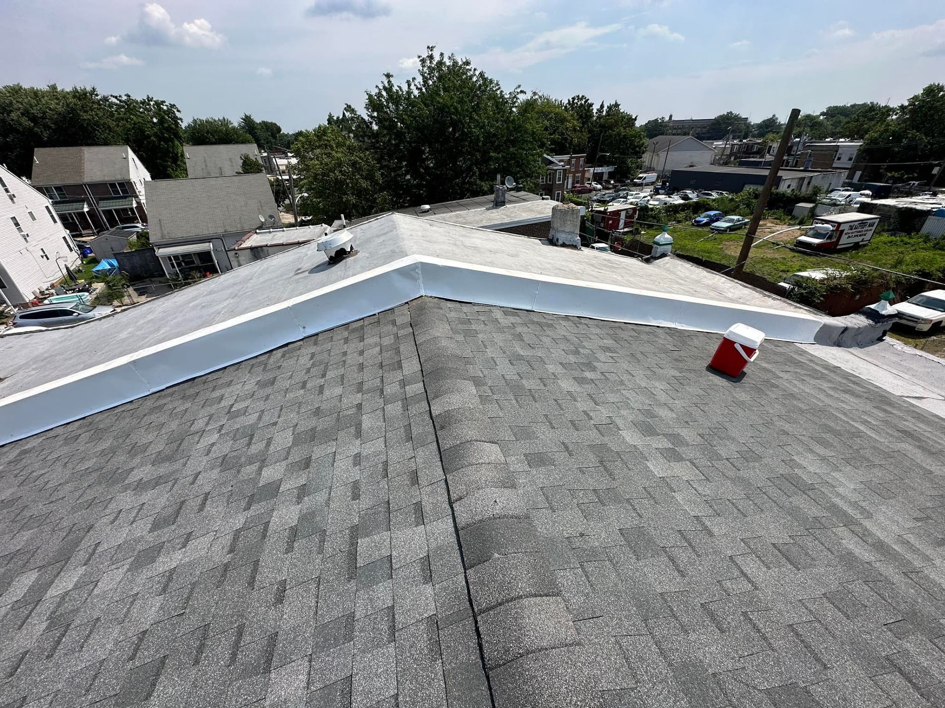 Completed shingle and flat roof combination