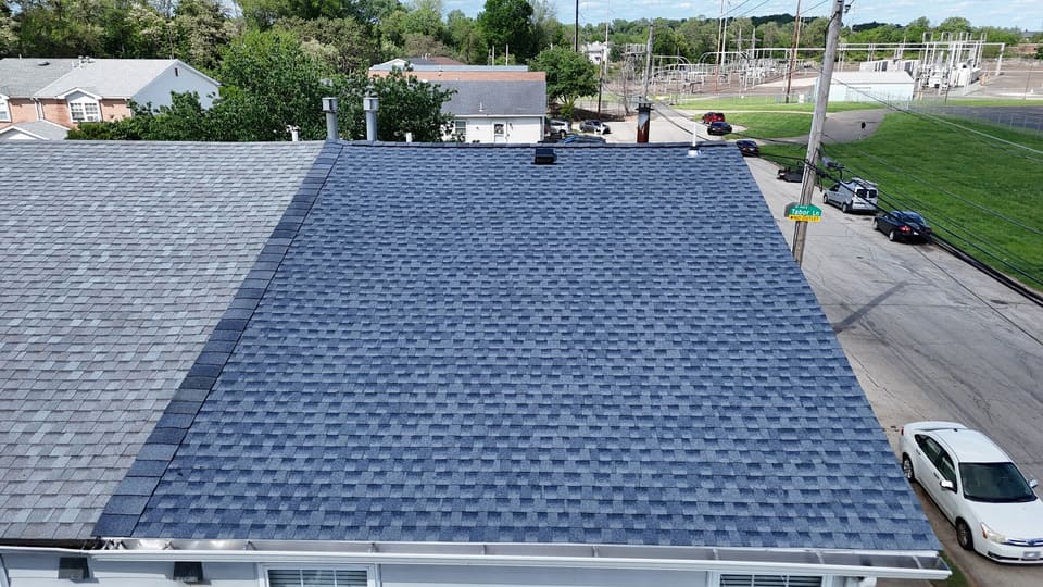 The finished blue grey shingle roof