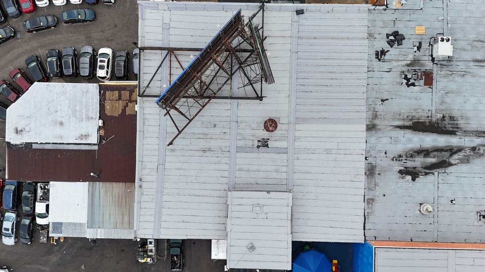 Close drone view of a large commercial flat roof