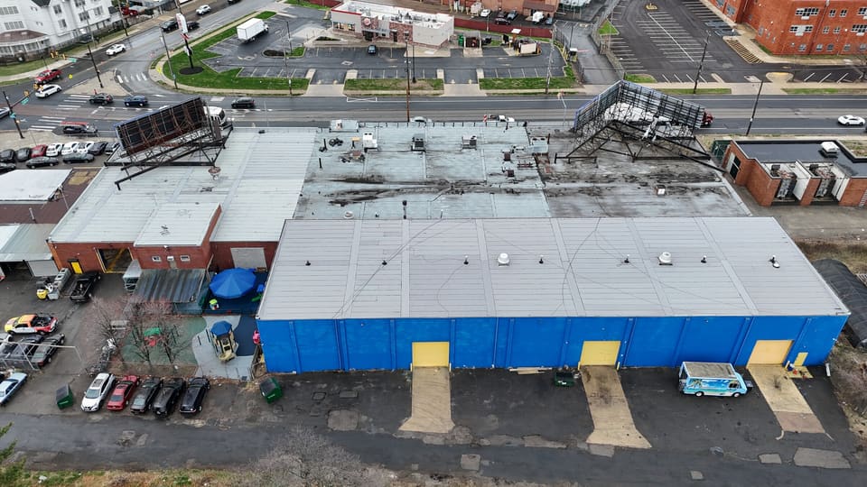 Drone view of a commercial warehouse and its flat roof