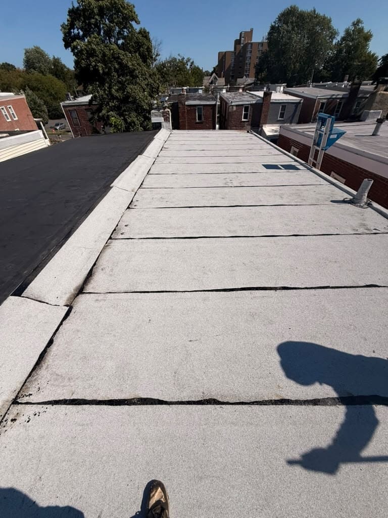 A finished flat roof over a row home rear