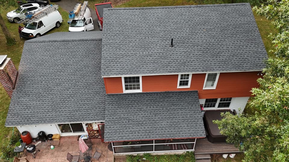 The finished roof and orange siding from above the back yard