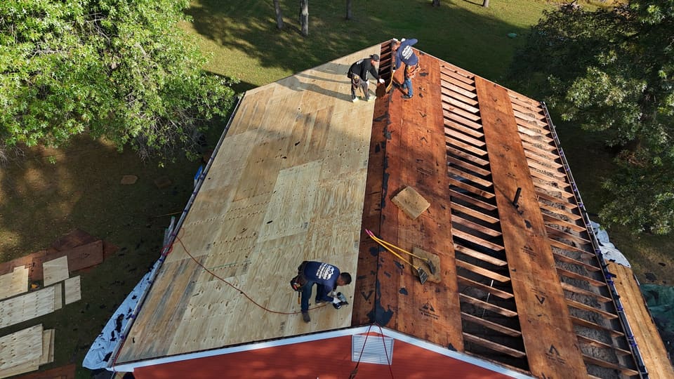New plywood decking going on over the rafters