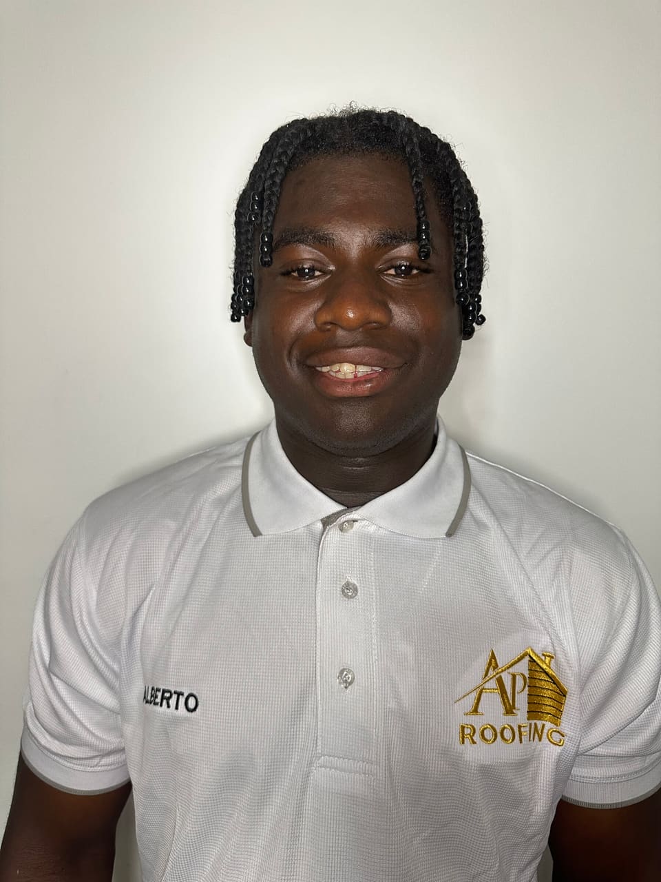 AP Roofing team member in a company polo